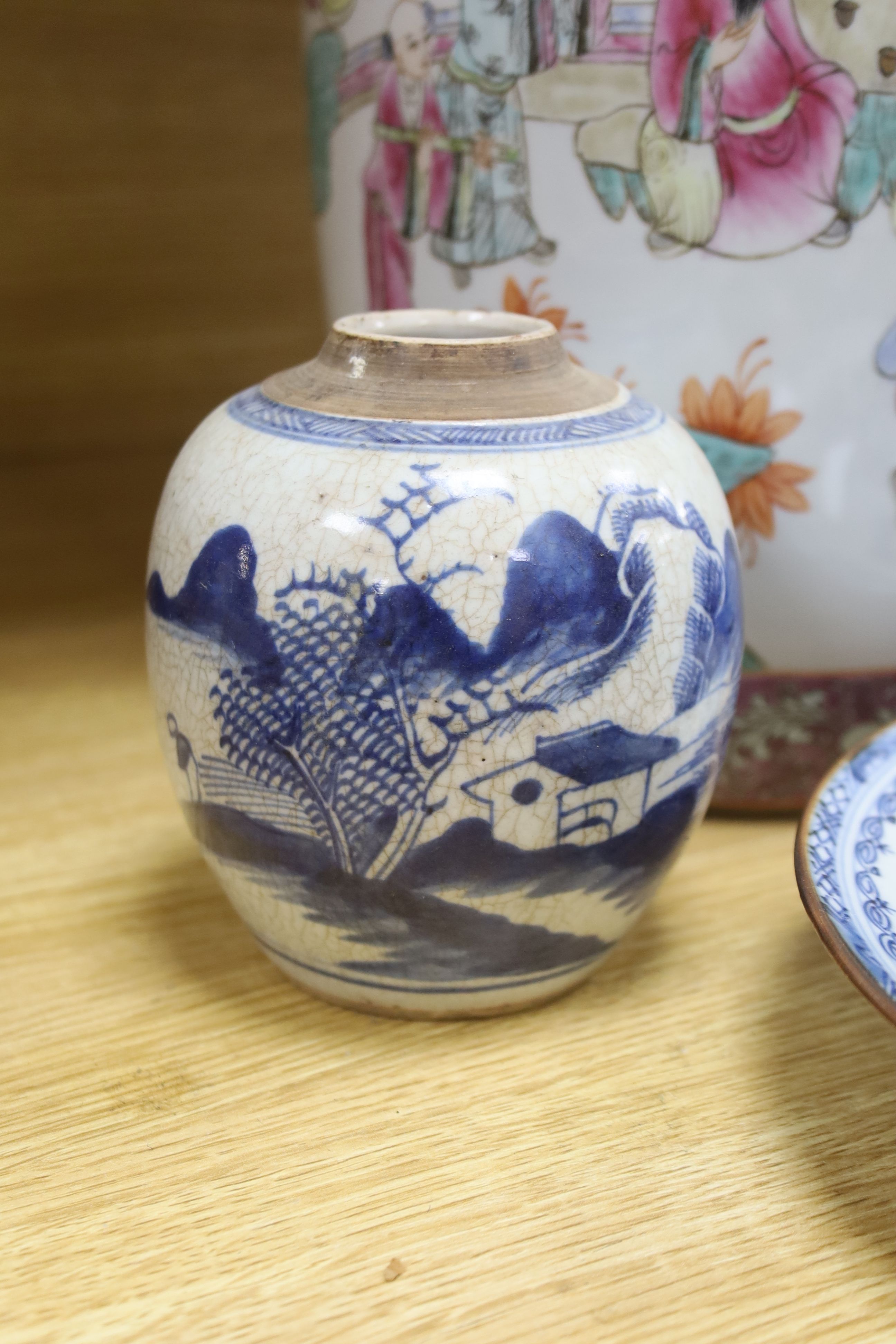 A Chinese blue and white dish, a bottle vase and jar, together with a famille rose jar lacking cover, height 29cm